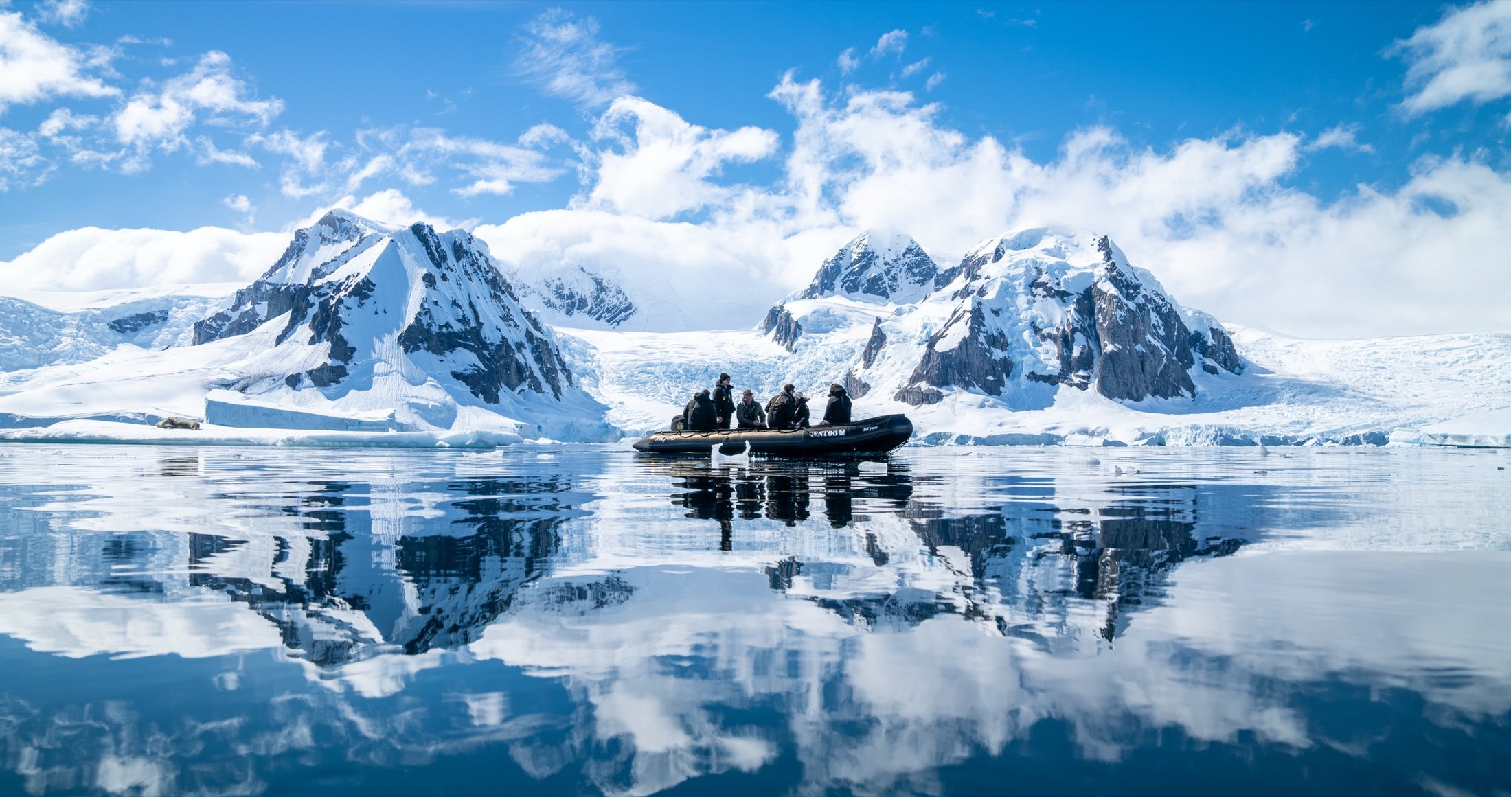 Mountains mirrored in still water
